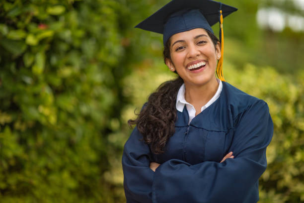 Young Hispanic woman graduating stock photo