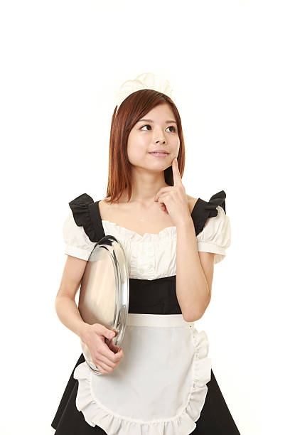 young Japanese woman posing in french maid costume portrait of young Japanese woman wearing french maid costume french maid outfit stock pictures, royalty-free photos & images