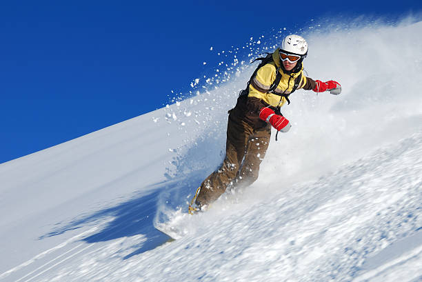Young lady snowboarder stock photo