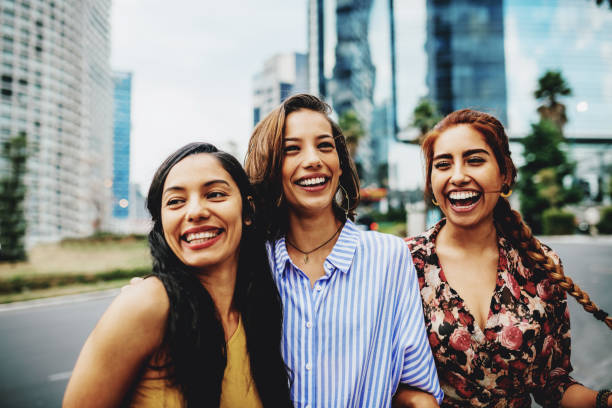 Young Latina women traveling together for a city break Mexican millennial women enjoying their lifestyles columbian woman stock pictures, royalty-free photos & images