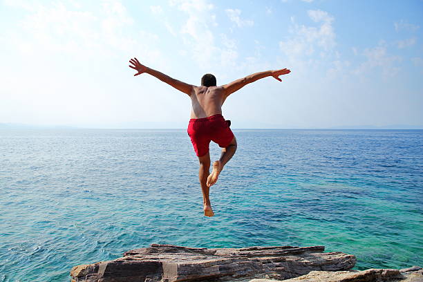Young man diving stock photo