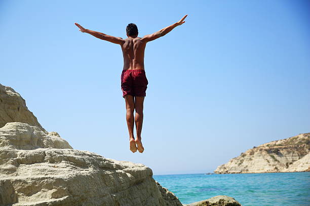 Man Cliff Diving Stock Photos, Pictures & Royalty-Free Images - iStock