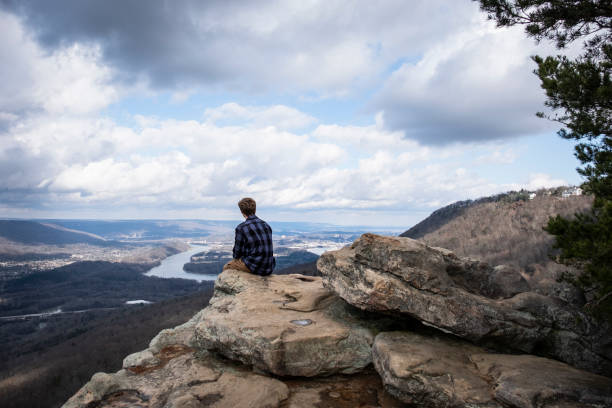 Young Man Enjoying the View from Lookout Mountain A young man enjoying the view from Sunset Rock on Lookout Mountain, outside of Chattanooga Tennessee. tennessee river stock pictures, royalty-free photos & images