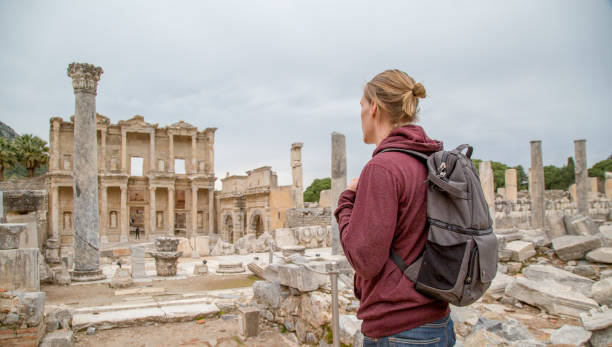 Young man explores ancient Byzantine ruins He looks off to archeological site ancient history stock pictures, royalty-free photos & images