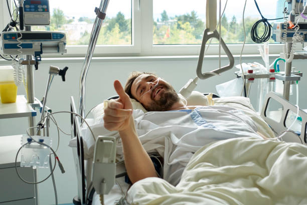 Young man giving a thumbs-up after a Successful Surgery stock photo