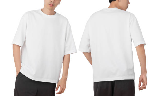Young man in blank oversize t-shirt mockup front and back used as design template, isolated on white background with clipping path Young man in blank oversize t-shirt mockup front and back used as design template, isolated on white background with clipping path. oversized object stock pictures, royalty-free photos & images