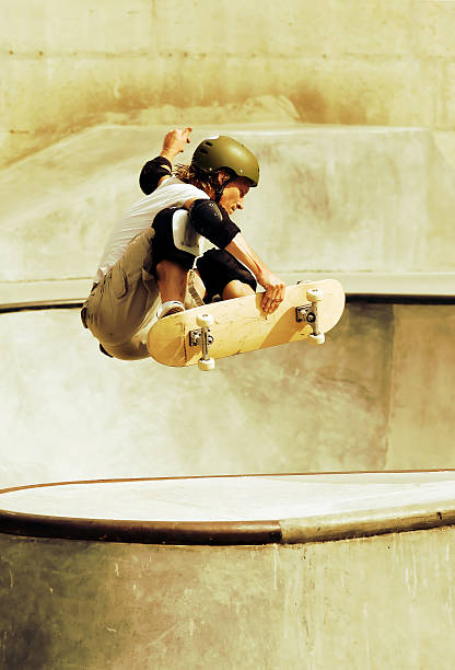 Young Man Skateboarding in Skate Park stock photo