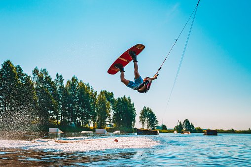 Young man wakeboarding on a lake