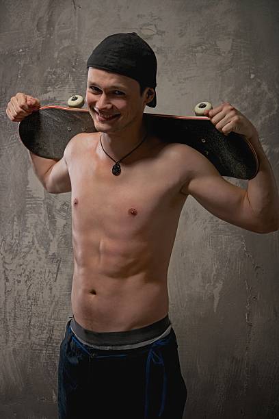 Young man with a skateboard stock photo