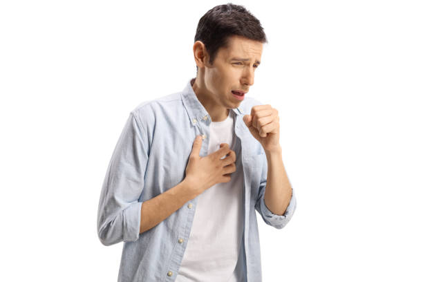 Young man with suffering an allergy and sneezing stock photo