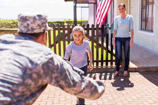 young military family reunion happy young american military family reunion soldiers returning home stock pictures, royalty-free photos & images