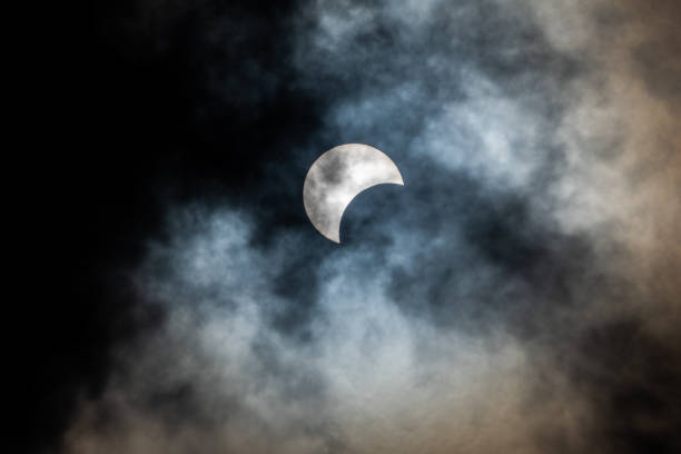 Young moon with dark cloud stock photo