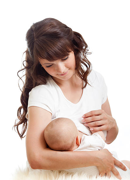 young mother breast feeding her infant stock photo