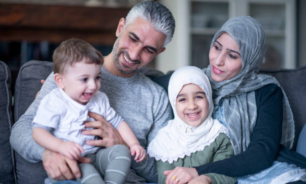 Young Muslim family with two children stock photo