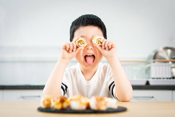 831 Kid Eating Sushi Stock Photos, Pictures & Royalty-Free Images - iStock