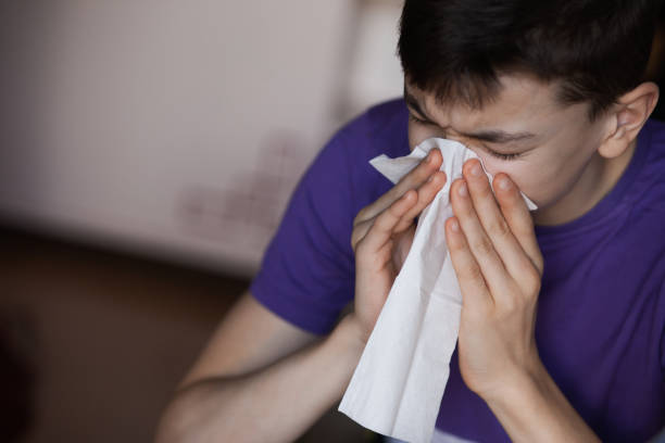 Young person have a problem with allergies People in a process of healing. Allergies problem.  Very Shallow DOF. Developed from RAW; retouched with special care and attention; Small amount of grain added for best final impression. antihistamine stock pictures, royalty-free photos & images