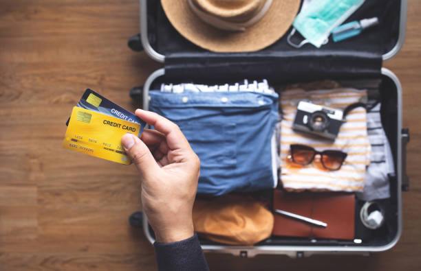Young person using credit cards for payment on vacation or holiday trip.convenient  lifestyle with technology. stock photo