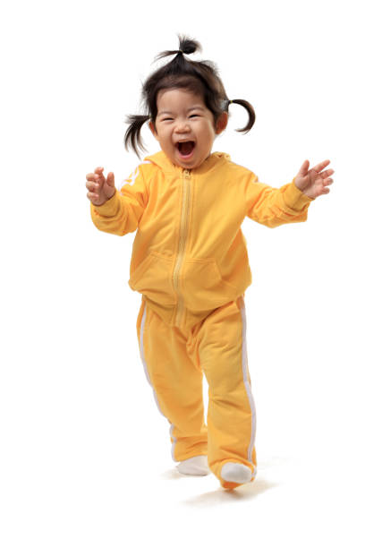 Young The Asian baby on the whitebackground. asian girl stock pictures, royalty-free photos & images