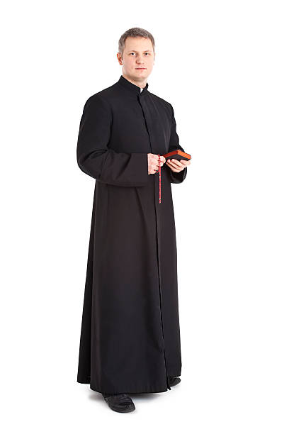 young priest stock photo