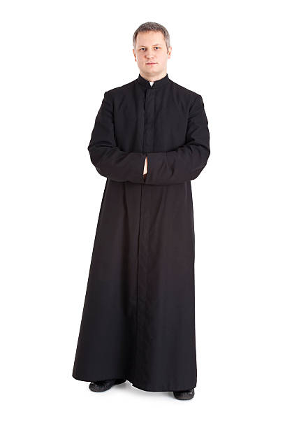 young priest stock photo