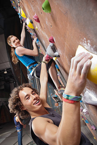 Young Rock Climbers at the Gym Young Rock Climbers at the Gym. crag stock pictures, royalty-free photos & images