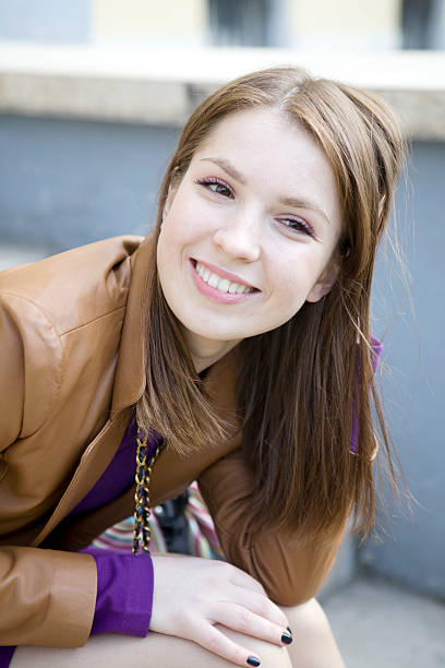 young smiling woman with long hair stock photo