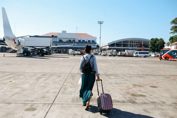Young solo traveler woman arriving in Bali, Indonesia stock photo