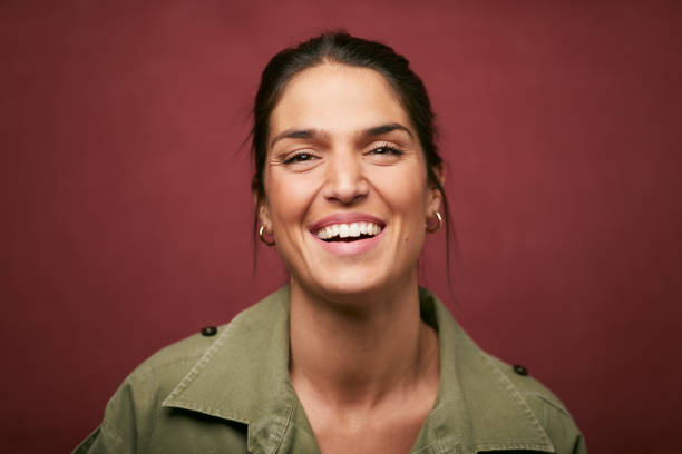A young Spanish woman laughing. stock photo