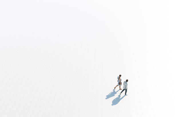 Young Stylish Caucasian Couple Walking, High Angle View, Isolated Against White, Unrecognizable stock photo