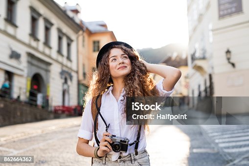 istock Young tourist with camera in the old town 862664362