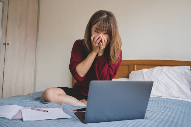 Young university student feeling surprise and excited celebrating her success with laptop on bed A young university student celebrating great successful achievement result online, good email news, motivated by great offer opportunity, passed exam, accepted for internship, admitted to university concepts. scholarships for females stock pictures, royalty-free photos & images