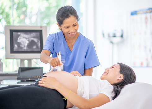 Young Woman At Pregnancy Check Up  Stock Photo Download 