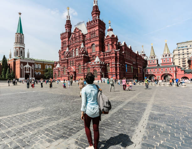 Young woman at red square stock photo