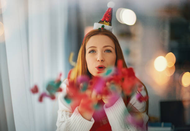 Young woman celebrating New Year. stock photo