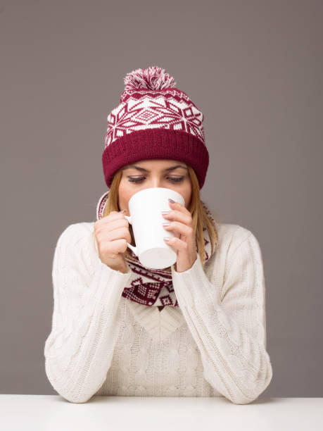 Young woman drinking tea stock photo
