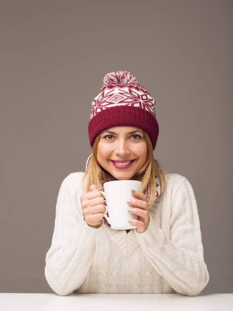 Young woman drinking tea stock photo