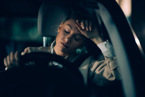 Young woman driving at late night stock photo