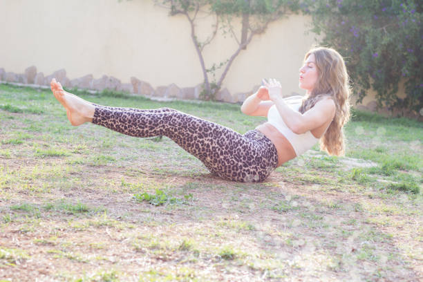 Young woman exercising outdoors stock photo