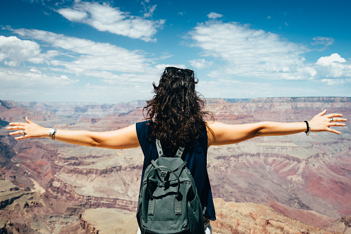 Young Woman Feels Free At Grand Canyon