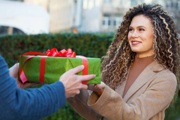 Young woman getting a present stock photo