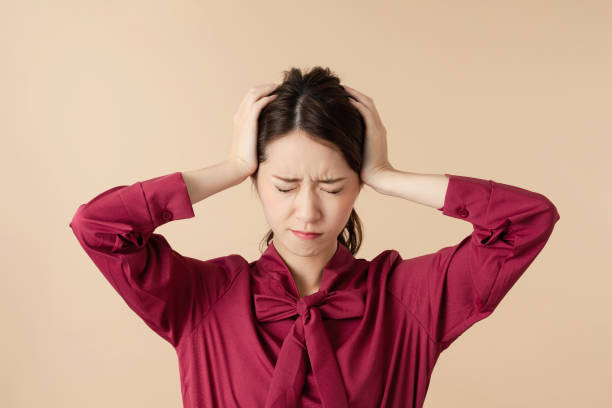 Young woman having a headache. Young woman having a headache. guilt stock pictures, royalty-free photos & images