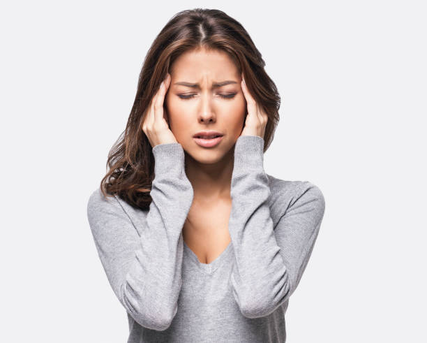Young woman having a headache headache stock pictures, royalty-free photos & images