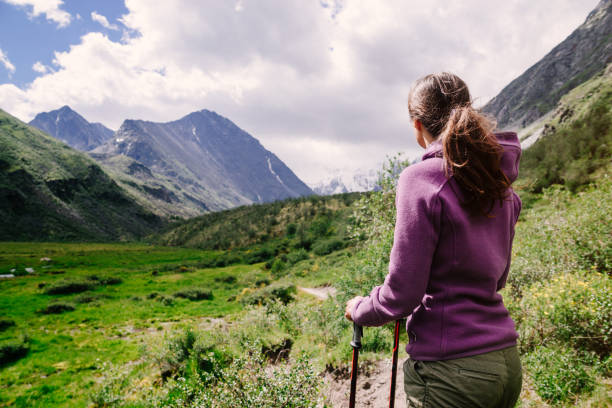 Young woman hiking Young woman hiking in mountains altai mountains stock pictures, royalty-free photos & images