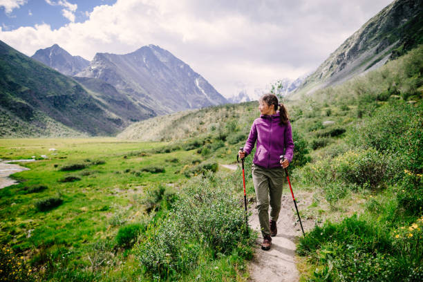 Young woman hiking Young woman hiking in mountains altai mountains stock pictures, royalty-free photos & images