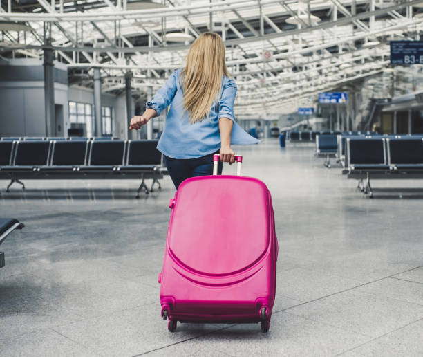 Young woman in airport stock photo