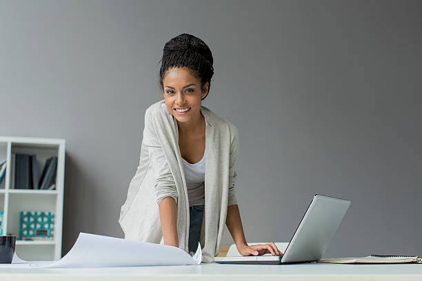 Young woman in the office stock photo