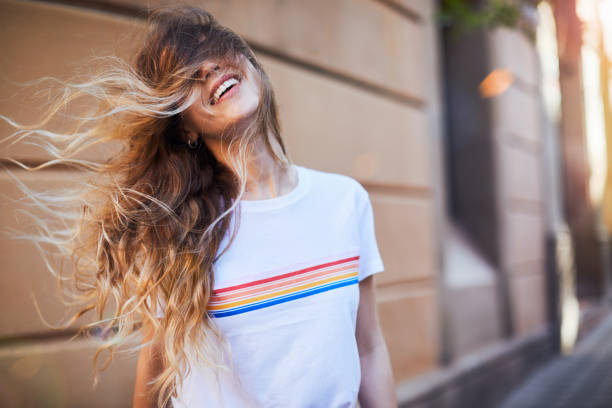 Young woman influencer posing for social media. One young woman posing for social media in Barcelona. long hair stock pictures, royalty-free photos & images