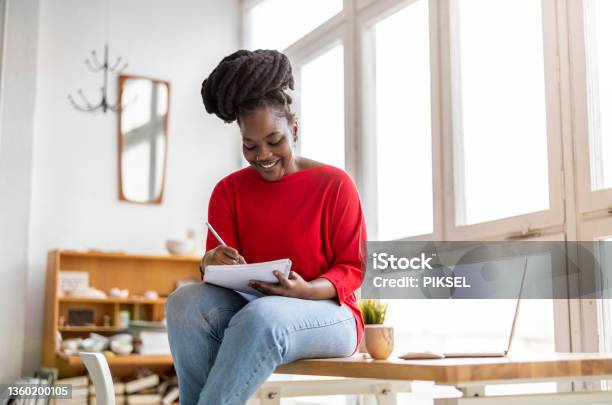 Young woman looking at paperwork in an office