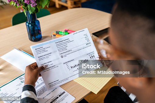istock A young woman looks at the electricity bill 1321935762