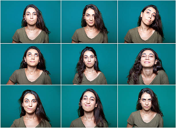 young woman making facial expressions - bildserie bildbanksfoton och bilder
